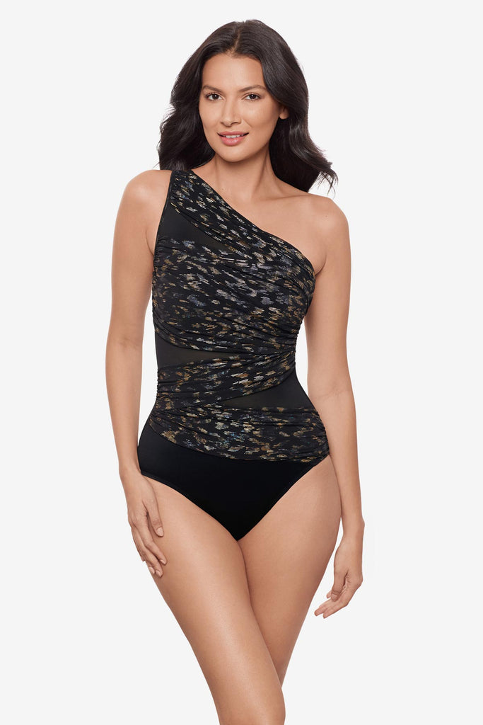 Woman wearing a one shoulder sparkly black one-piece swimsuit